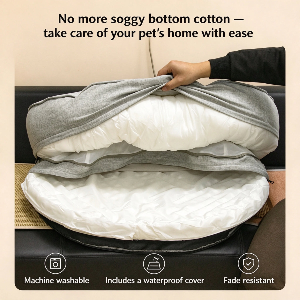 Donut dog bed with removable gray cover pulled back showing the white waterproof inner cover, machine washable and fade resistant